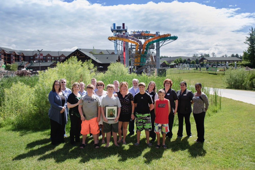 large family outside by waterpark ride enjoying a JAJF WOW experience 