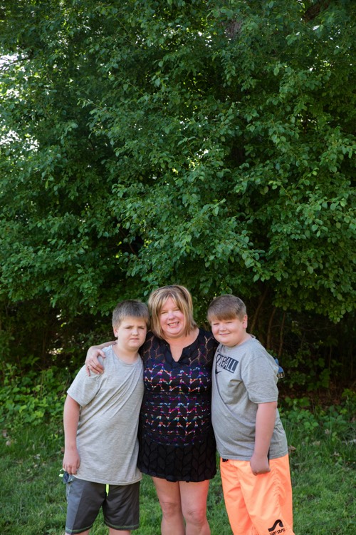 mom with two sons sitting outdoors enjoying a JAJF WOW experience 